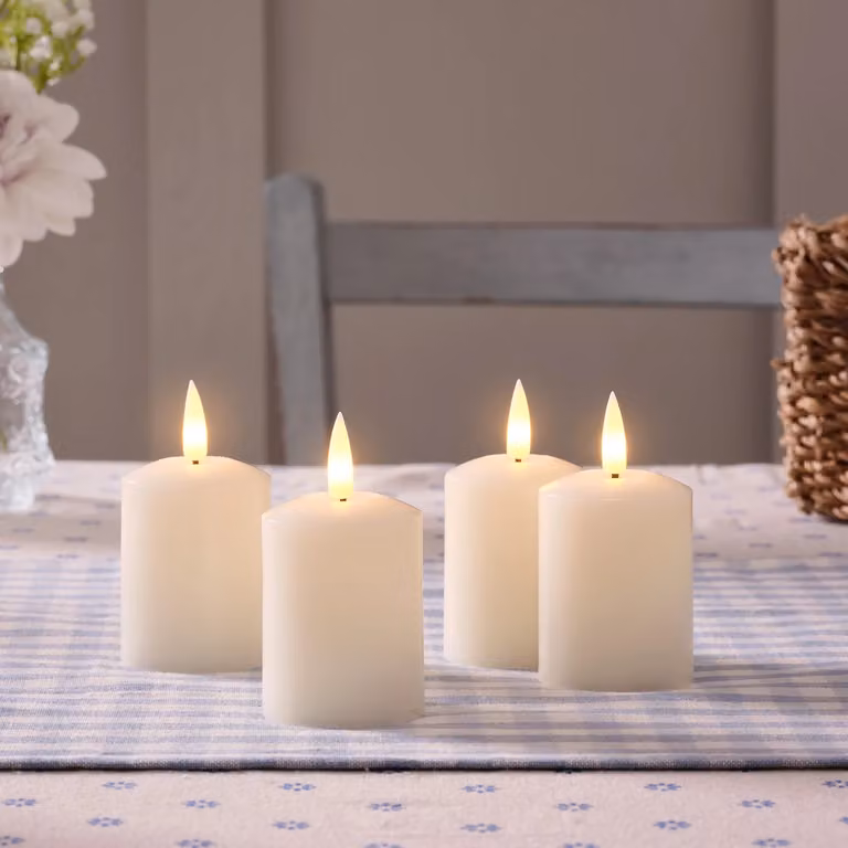 Lights4fun Set of 4 Ivory TruGlow Rechargeable USB LED Votive Tea Light Candles with Remote and Timer