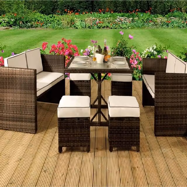 Comfy Living 7 Piece Brown Polyrattan Garden Furniture Set with Glass Table and Weather Resistant Cushions
