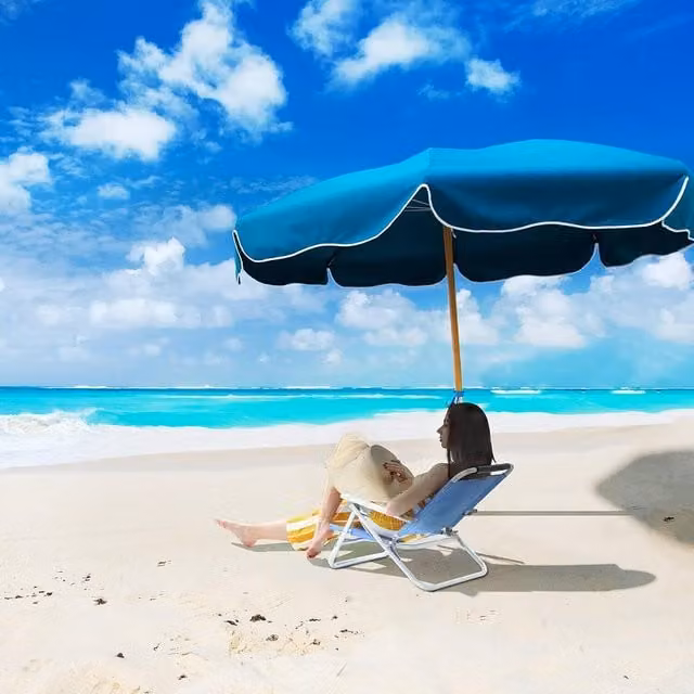 The Bazaarist Blue Folding Beach Chair with Adjustable Headrest and Armrests