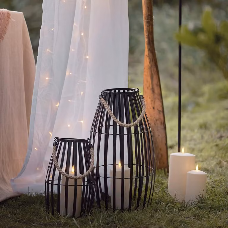 Lights4fun Set of 2 Black Metal Cage Waterproof Outdoor LED TruGlow Pillar Candle Lanterns with Timer and Flicker Effect